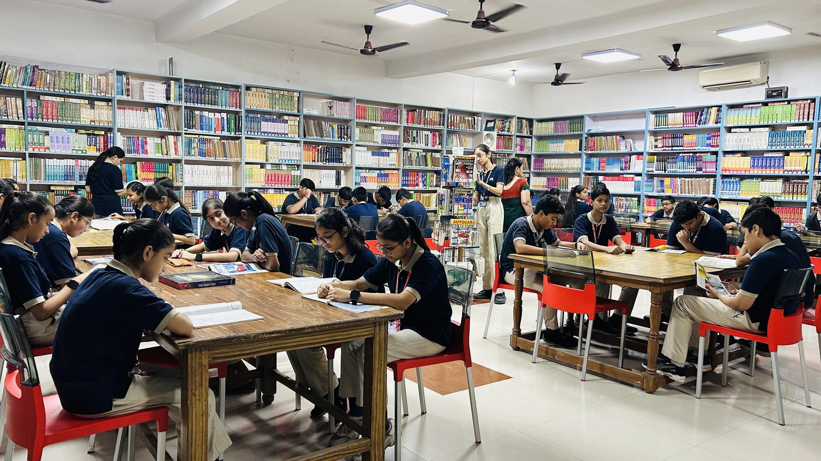 Students reading in the school library at Vidya Mandir Public School