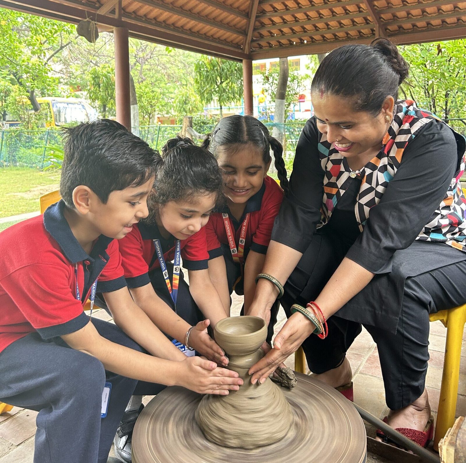 A young learner working with Montessori material in the pre-primary wing