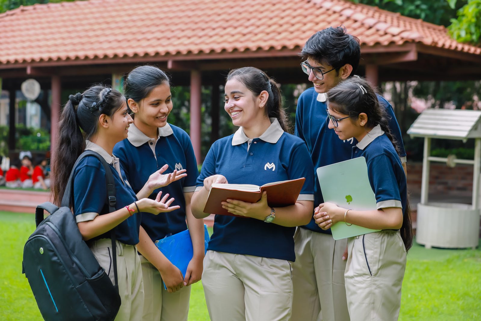 A classroom discussion between a teacher and students at Vidya Mandir Public School