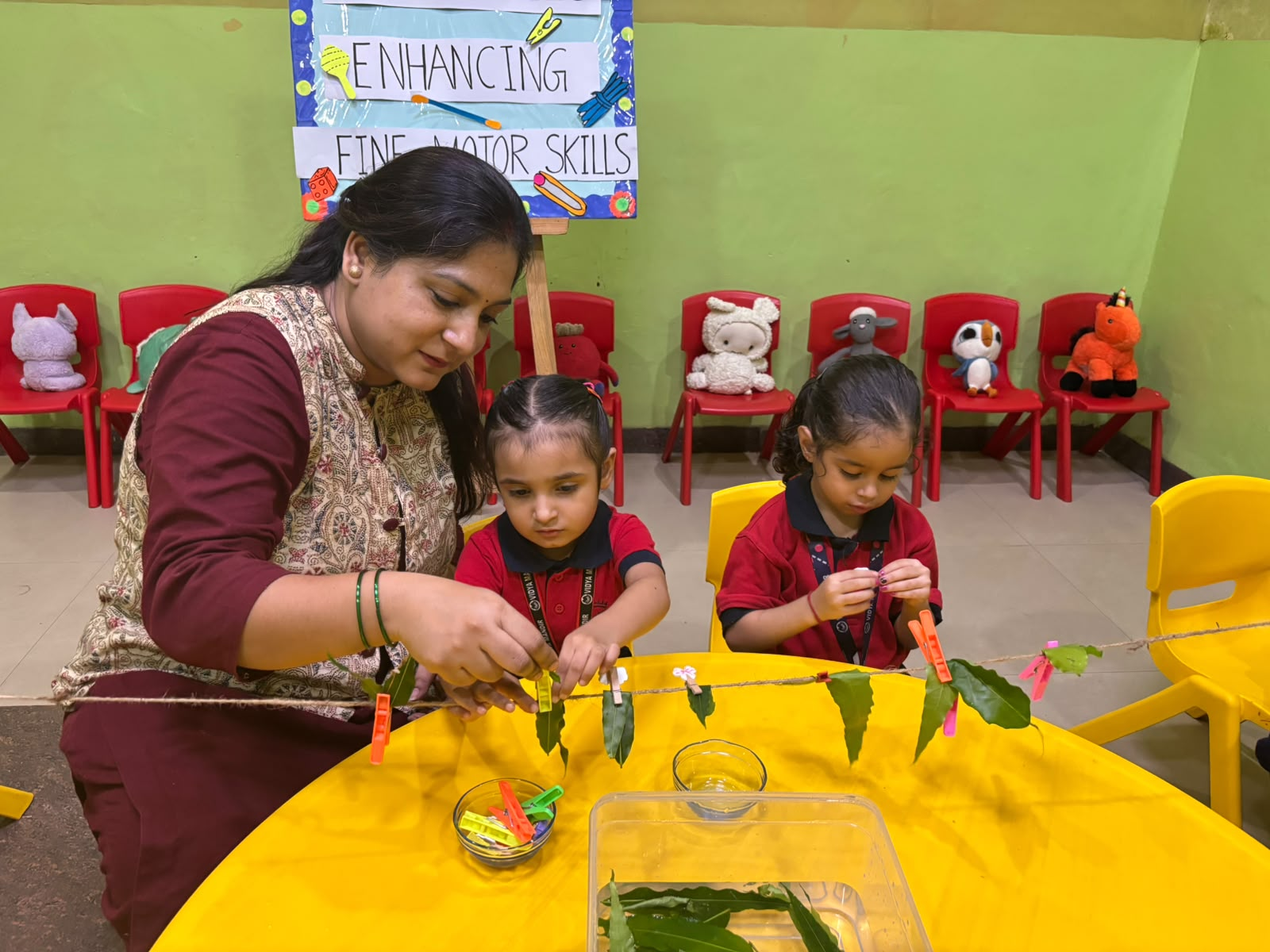 A young learner working with Montessori material in the pre-primary wing