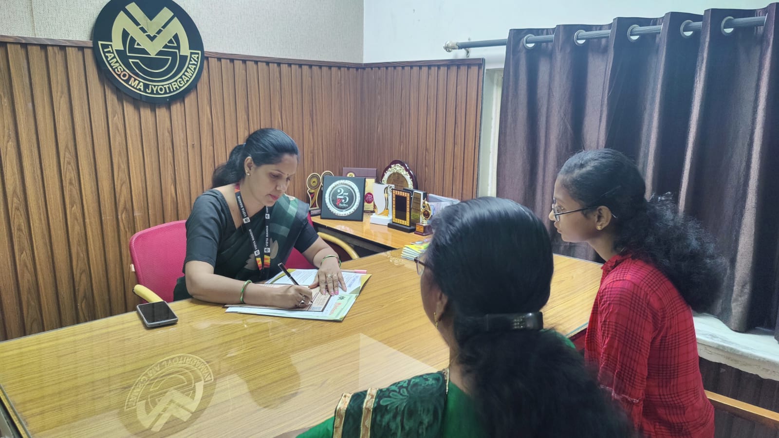 A parent interacting with a VMPS admission coordinator